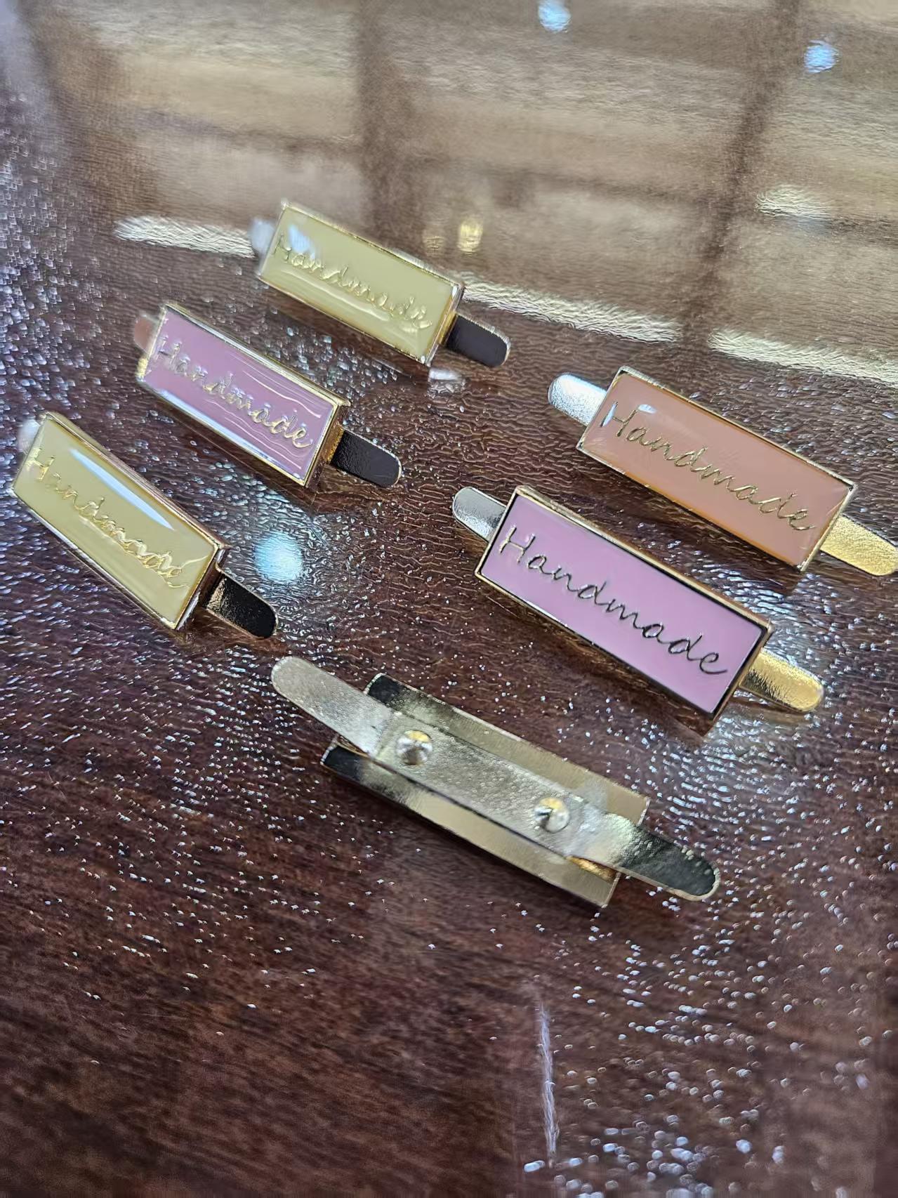 embossed logo custom metal fastener for garments brand gold custom tags metal clothing (复制) embossed logo custom metal fastener for garments brand gold custom tags metal clothing (复制)