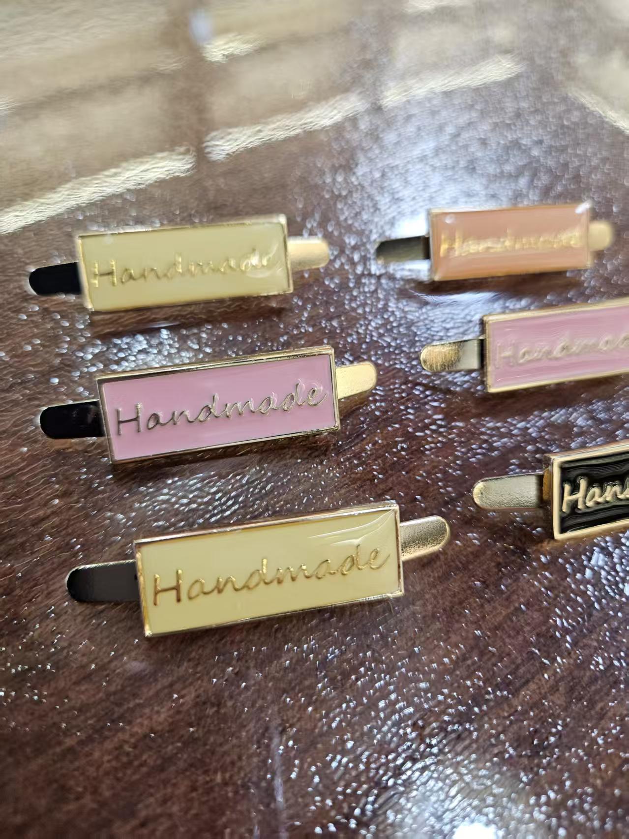 embossed logo custom metal fastener for garments brand gold custom tags metal clothing (复制) embossed logo custom metal fastener for garments brand gold custom tags metal clothing (复制)